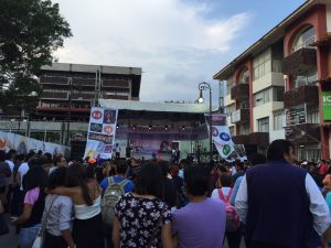 crowd looks up at stage